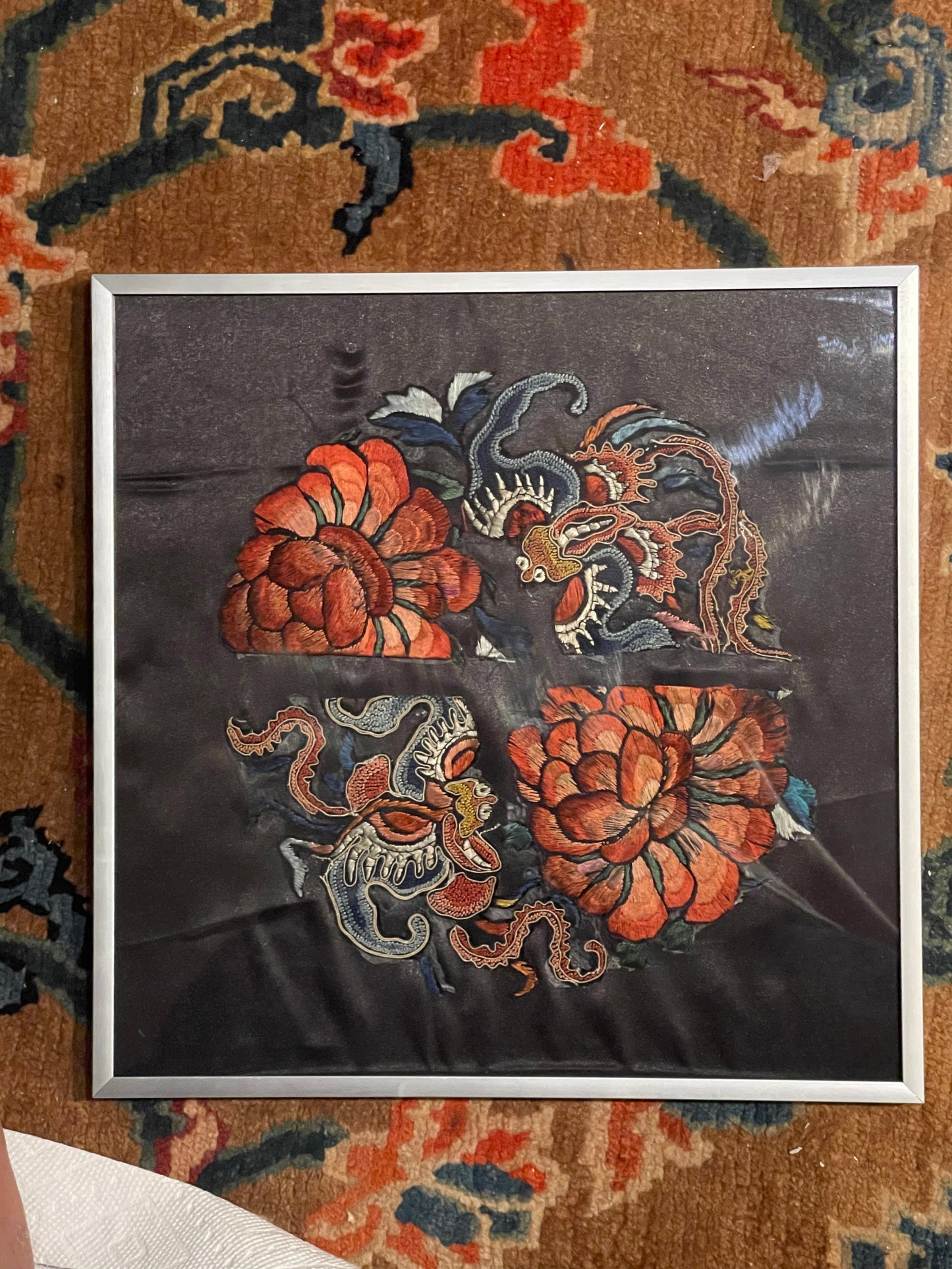 An antique framed Chinese embroidered textile fragment