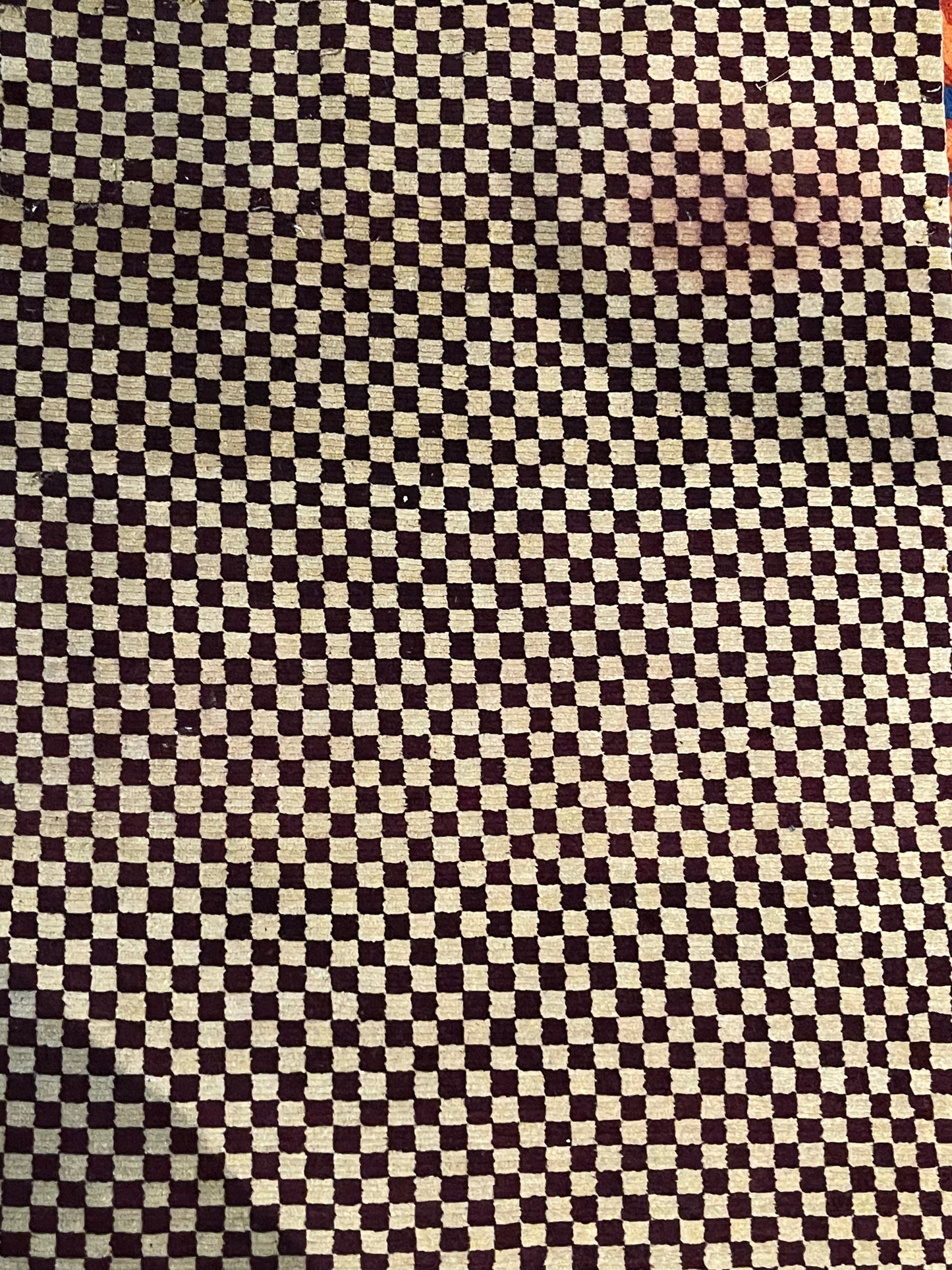 An antique Tibetan checkerboard handmade wool rug