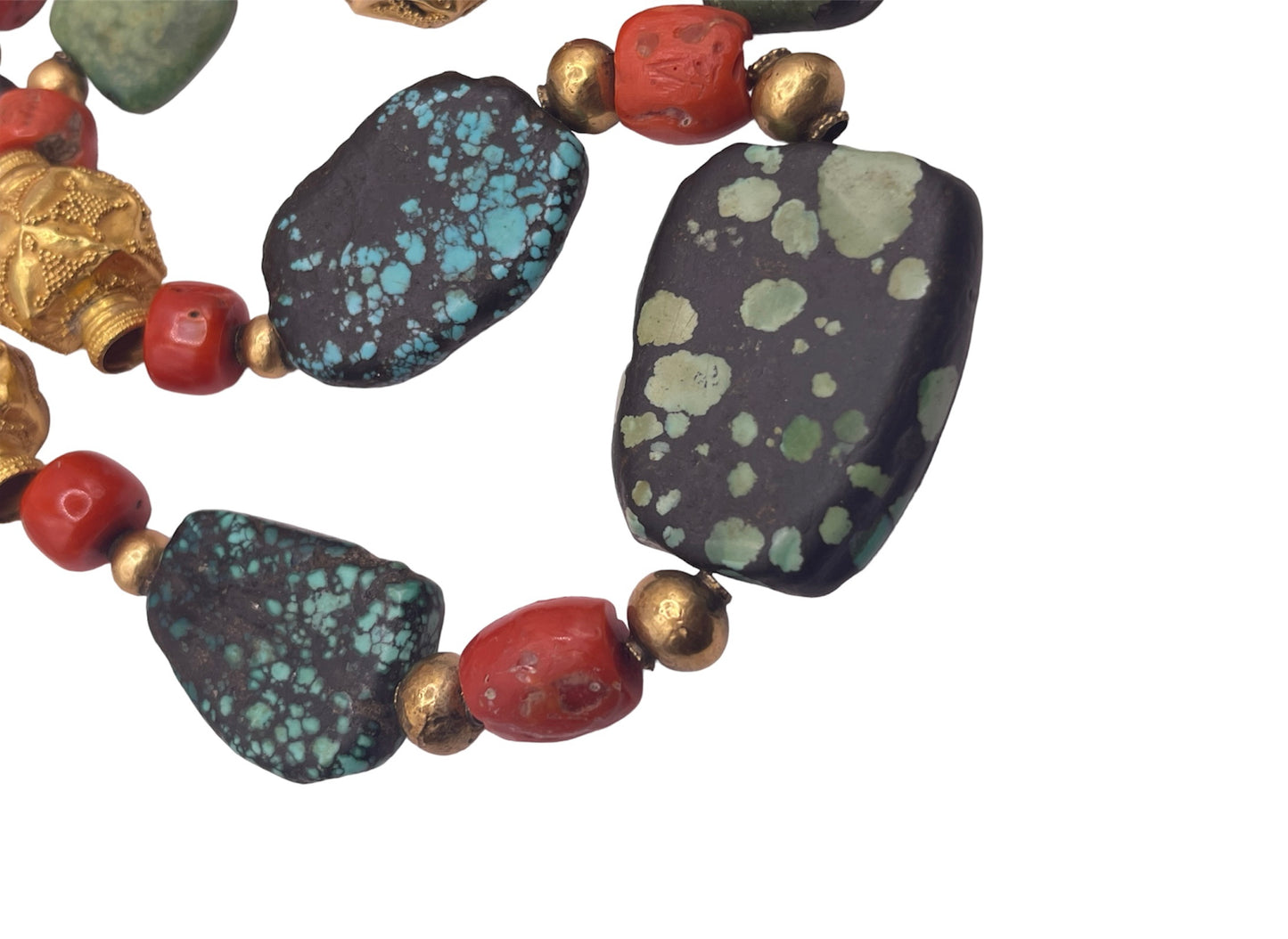 A necklace with antique Tibetan turquoise beads, coral beads and gold beads