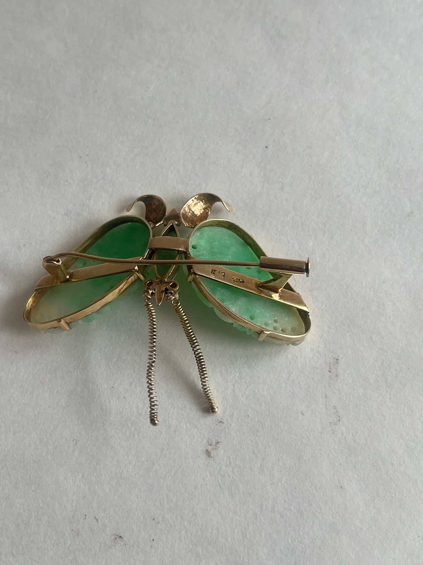 A vintage butterfly shaped brooch with jade and 14kt gold