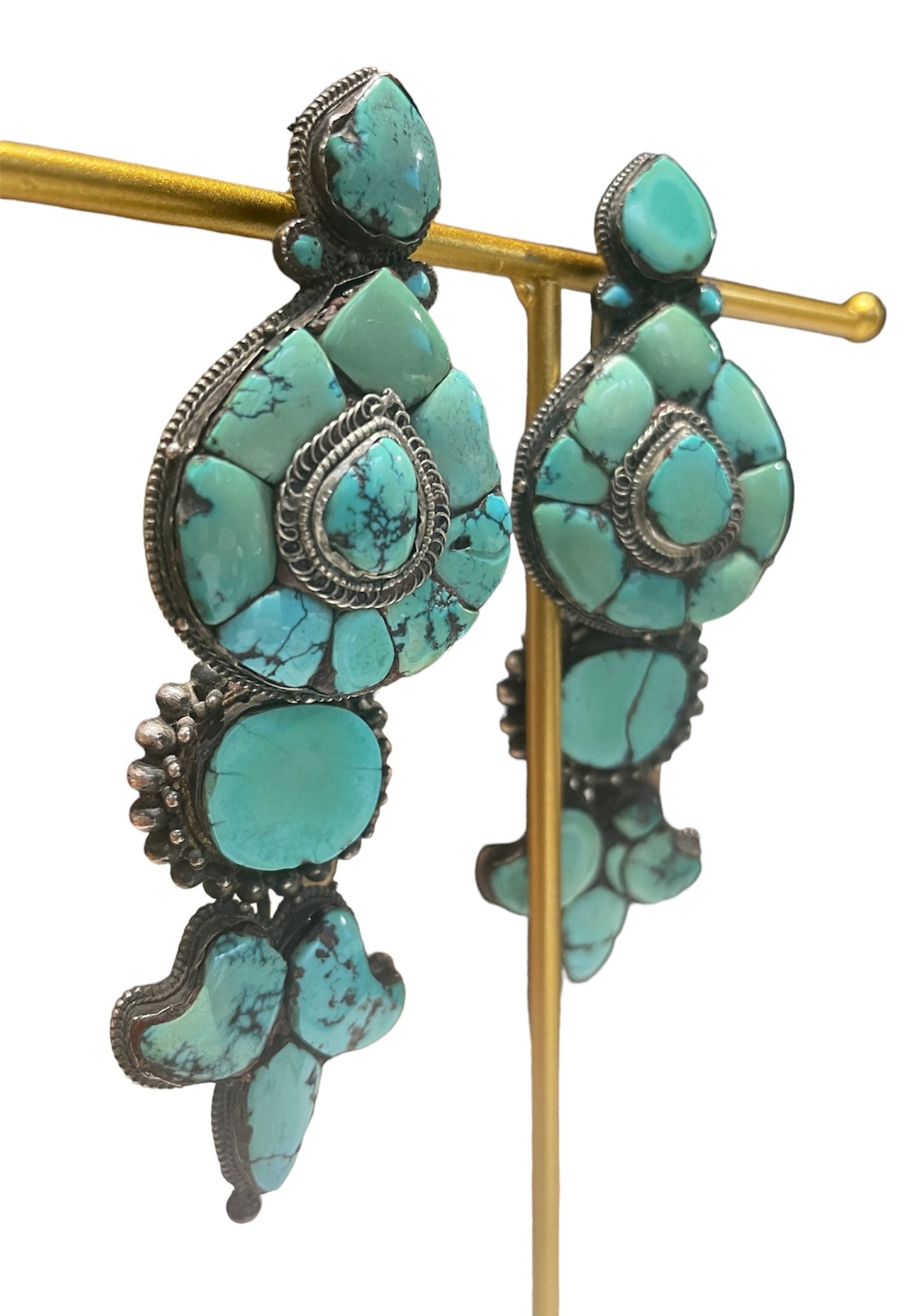 A pair of antique Tibetan turquoise and silver ear pendants