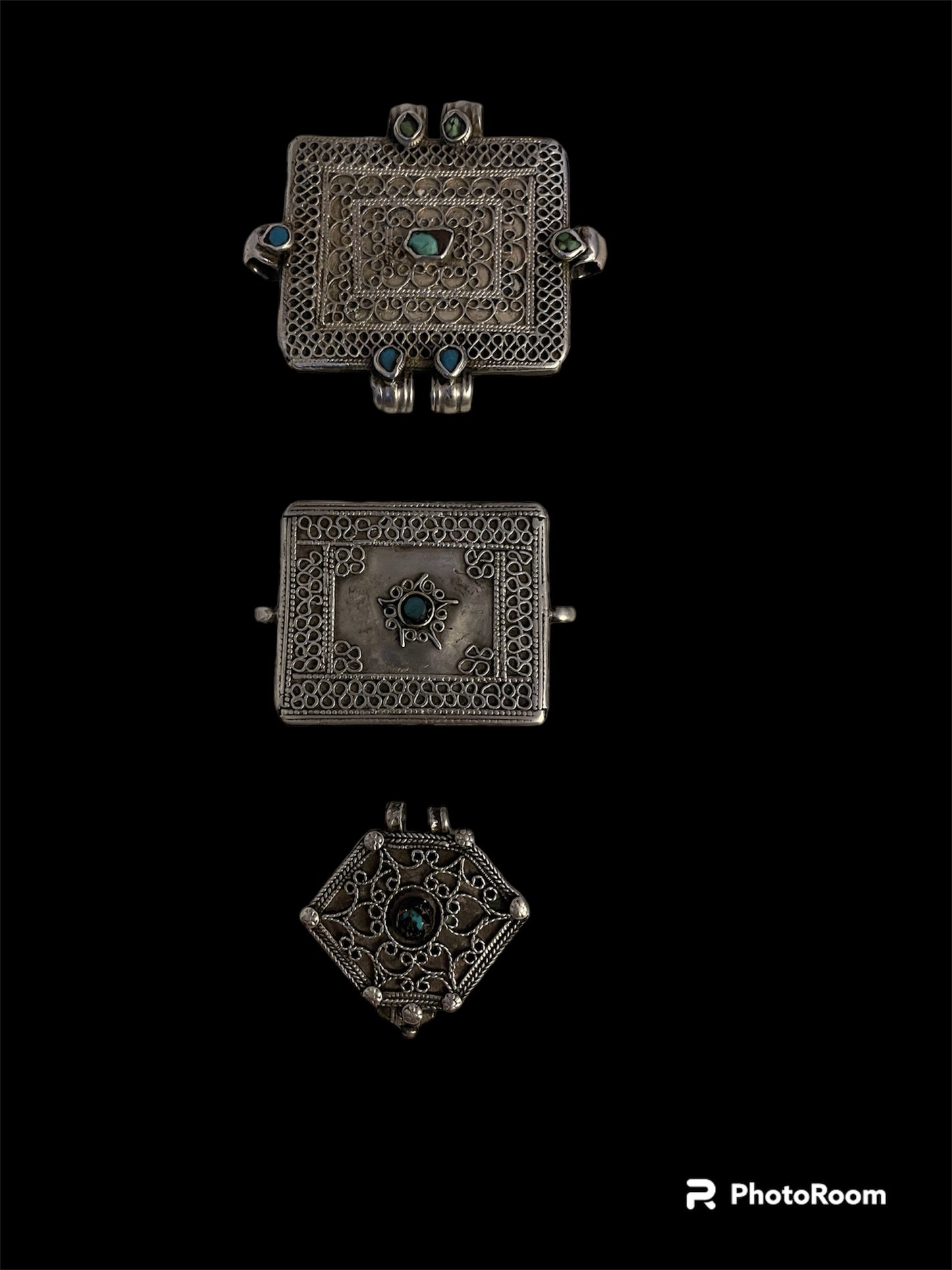 A set of three antique silver amulet boxes