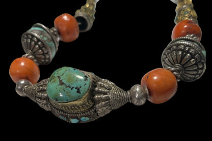 A necklace with antique Tibetan silver beads and coral