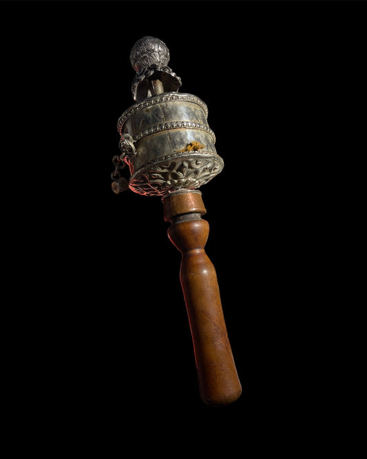 An original handmade vintage Tibetan silver handheld prayer wheel simply carved and decorated