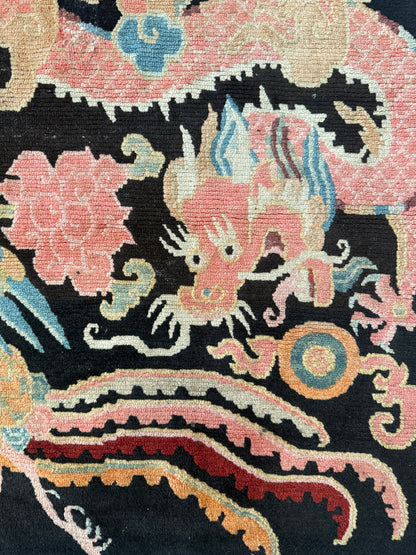 A mid 20th C., Tibetan dragon and phoenix rug