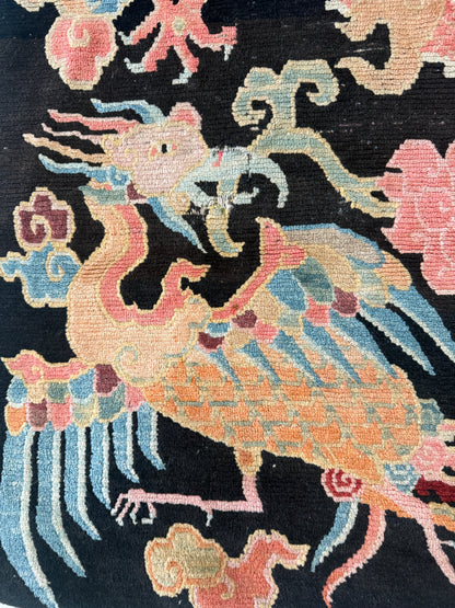 A mid 20th C., Tibetan dragon and phoenix rug