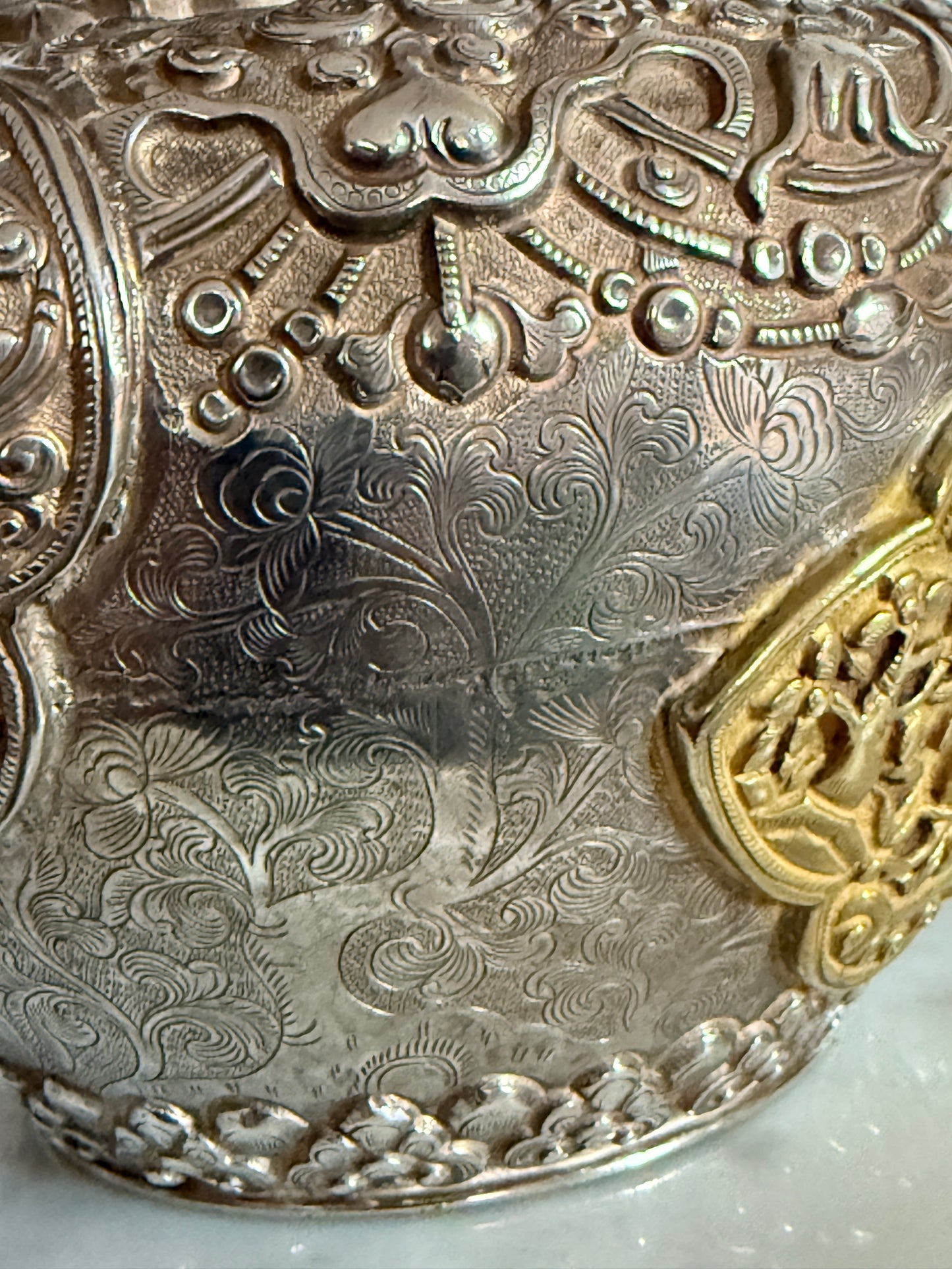 An antique silver and gilt ceremonial Tibetan teapot