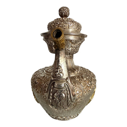 An antique silver and gilt ceremonial Tibetan teapot