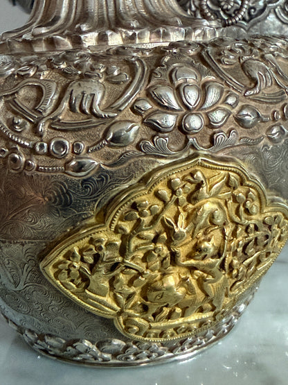 An antique silver and gilt ceremonial Tibetan teapot
