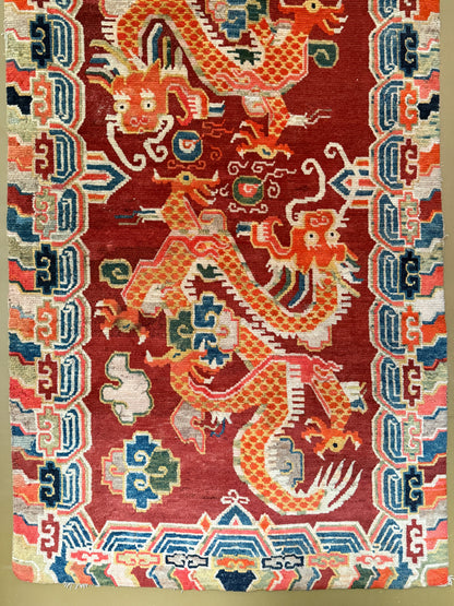 An early 20th C., antique Tibetan dragon rug