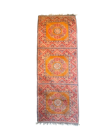 An antique triple seater Tibetan meditation rug