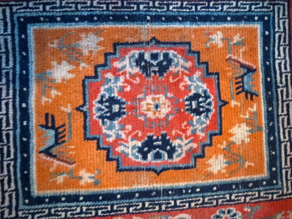 An antique meditation rug / saddle rug topper