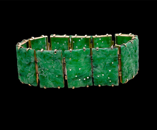 vintage bracelet with jade plaques in a 14kt setting hallmarked  Gumps