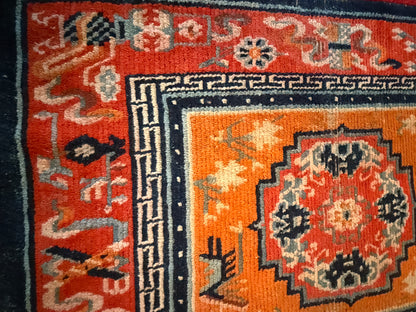 An antique meditation rug / saddle rug topper