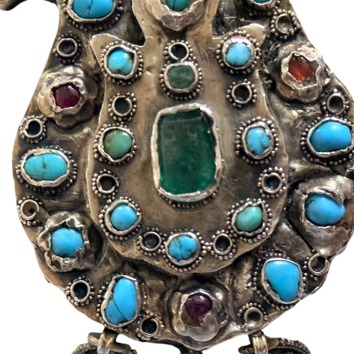 A silver antique turban brooch with turquoise, ruby and emeralds