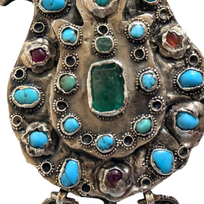 A silver antique turban brooch with turquoise, ruby and emeralds
