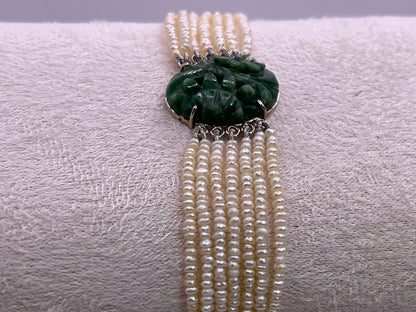 an antique seed pearl and jade plaque bracelet