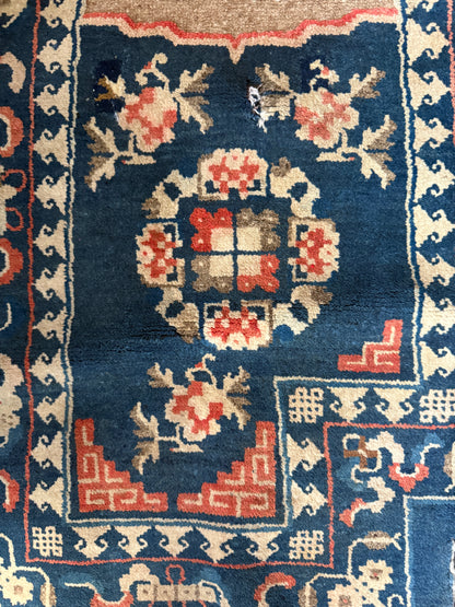 A vintage indigo saddle rug