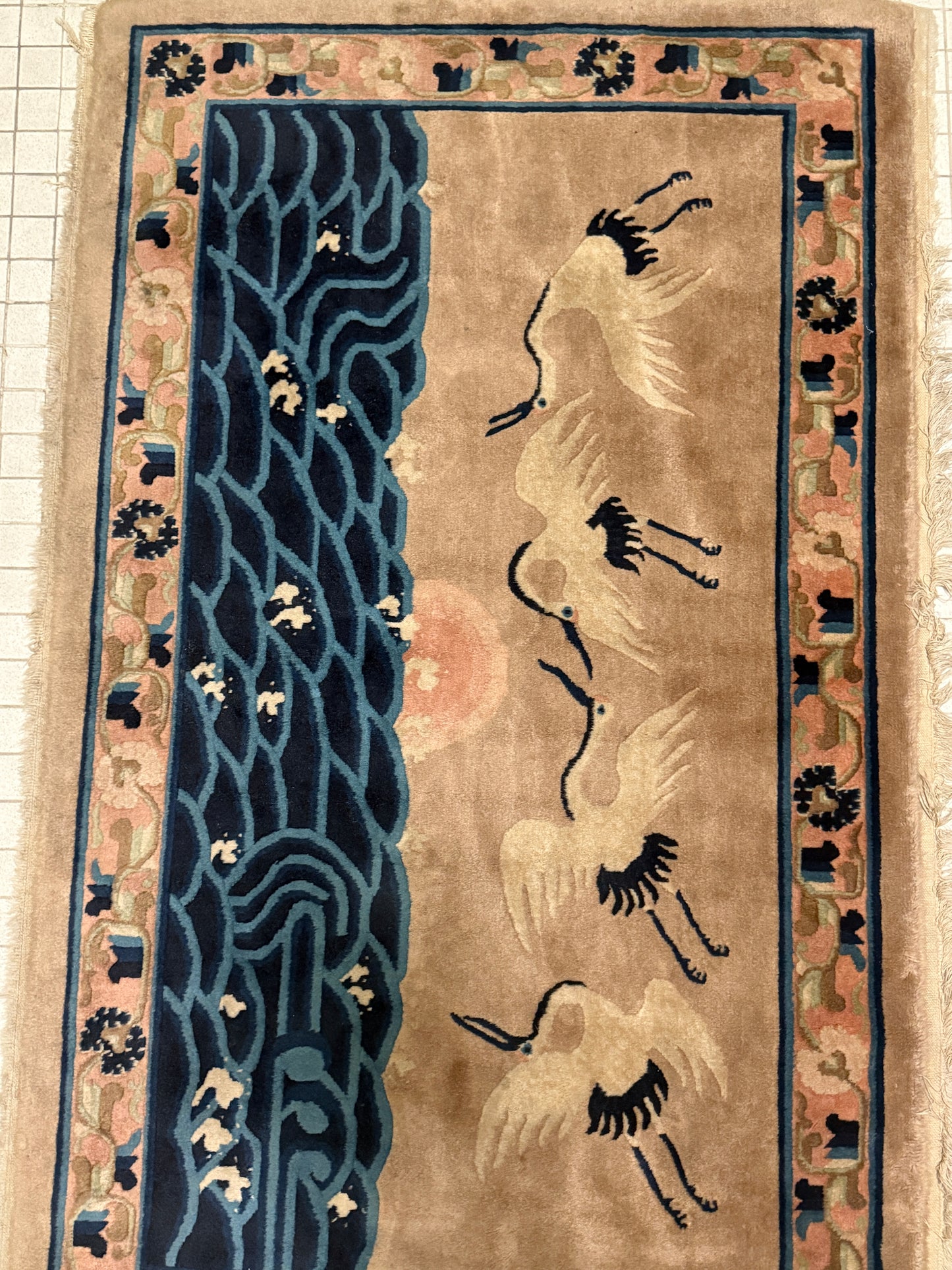 An antique Chinese pictorial rug