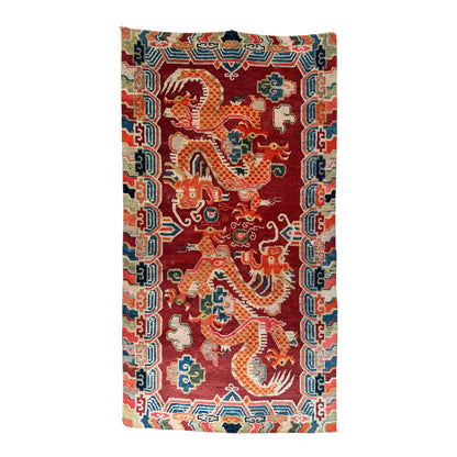 An early 20th C., antique Tibetan dragon rug