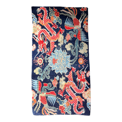 A mid 20th C., Tibetan dragon and phoenix rug