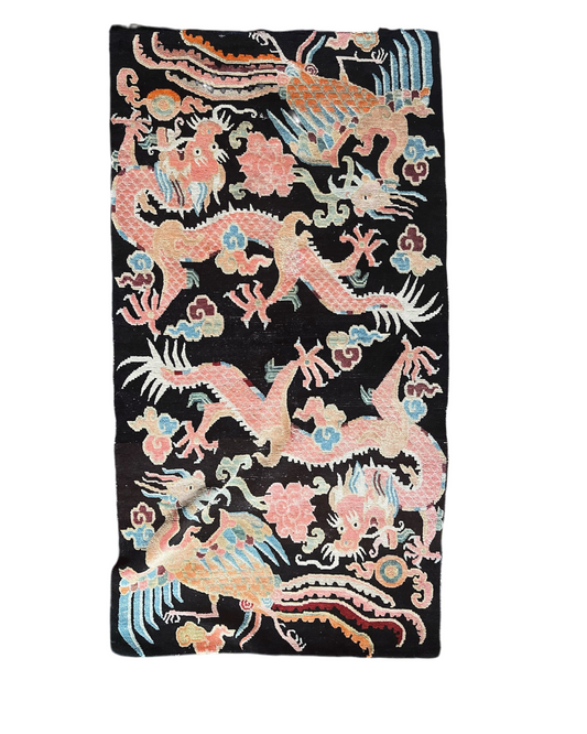 A mid 20th C., Tibetan dragon and phoenix rug