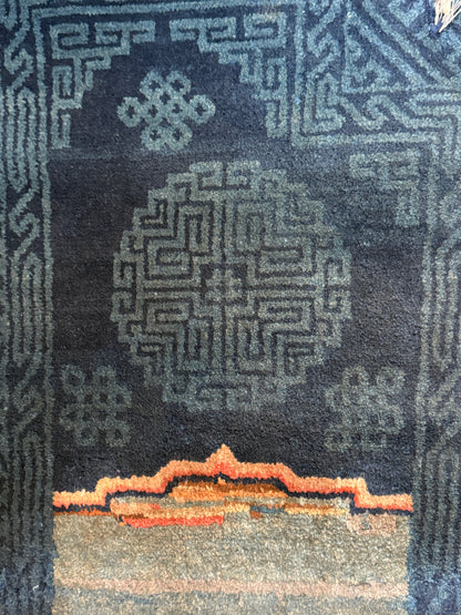 A vintage indigo Tibetan saddle rug