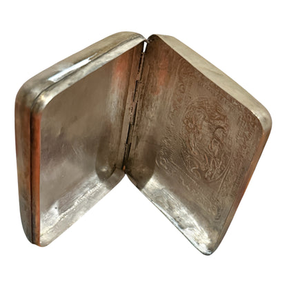 A silver box with hinged lid