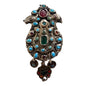 A silver antique turban brooch with turquoise, ruby and emeralds
