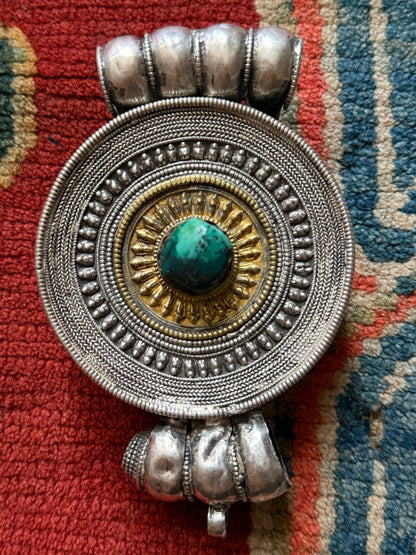 Large Antique Tibetan Silver Circular Ghau Pendant with Gilded Center and Turquoise Cabochon