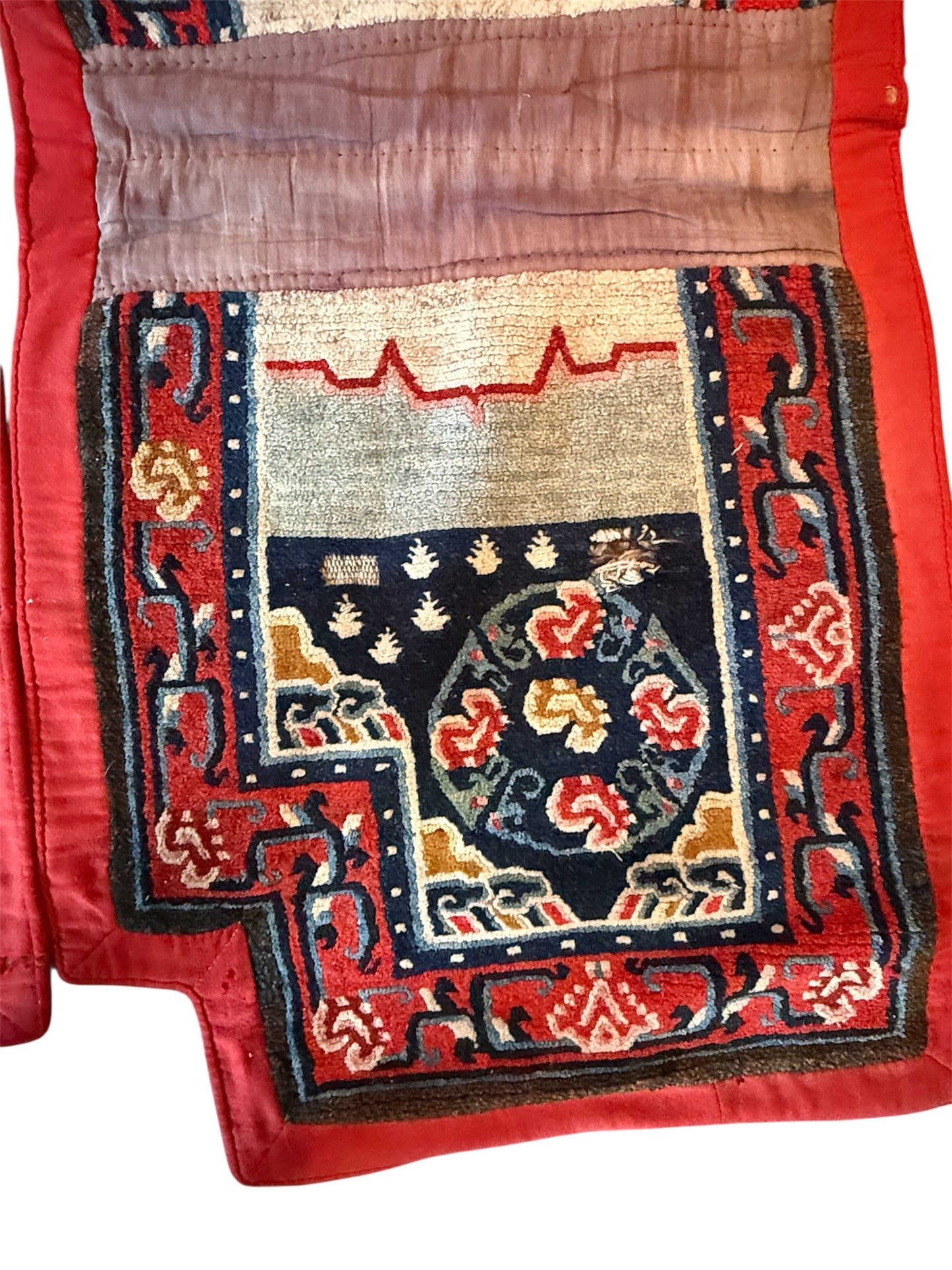 An antique Tibetan saddle rug and rug topper set