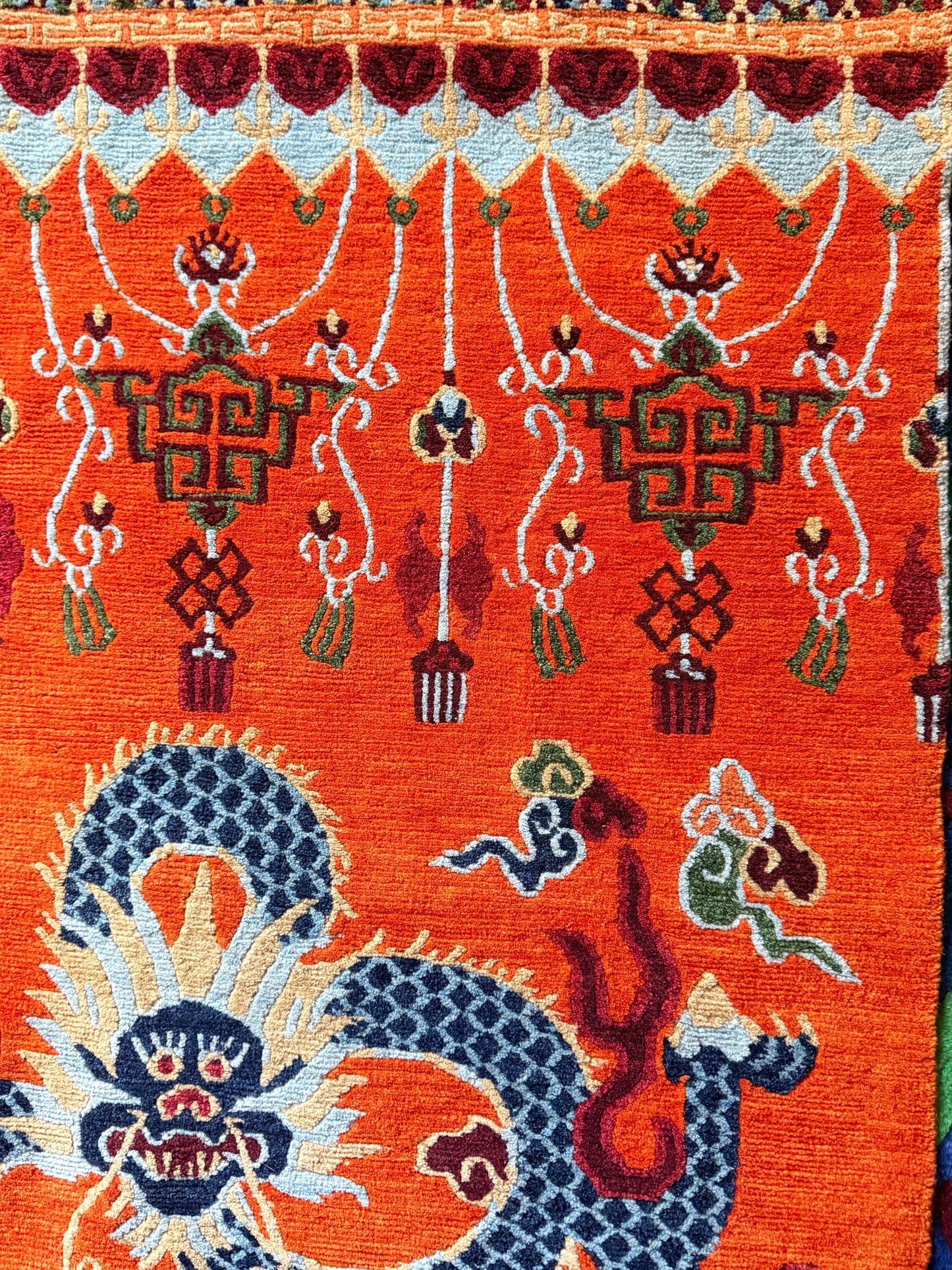 A vintage Tibetan dragon door rug