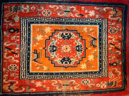An antique meditation rug / saddle rug topper