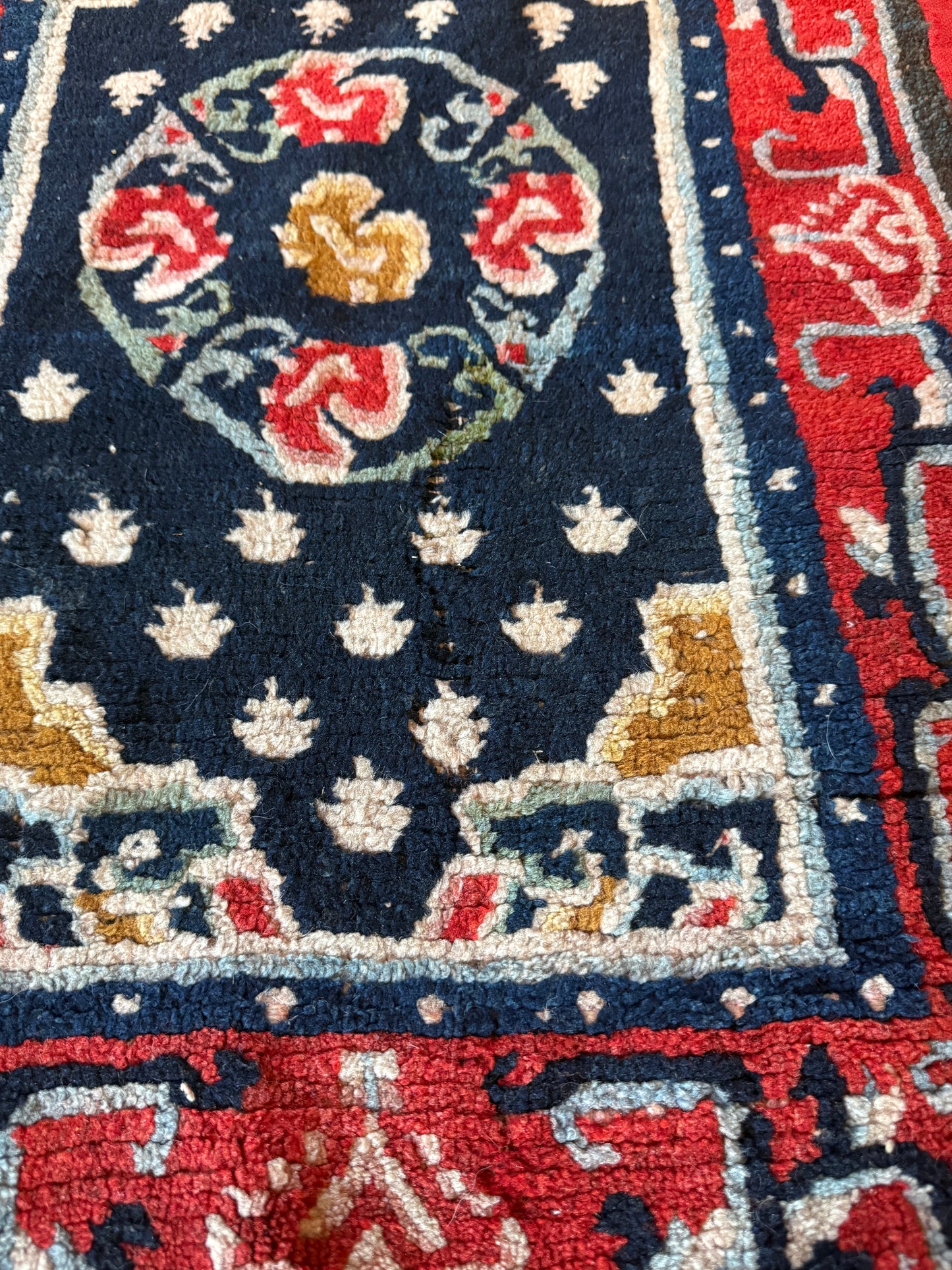An antique Tibetan saddle rug and rug topper set