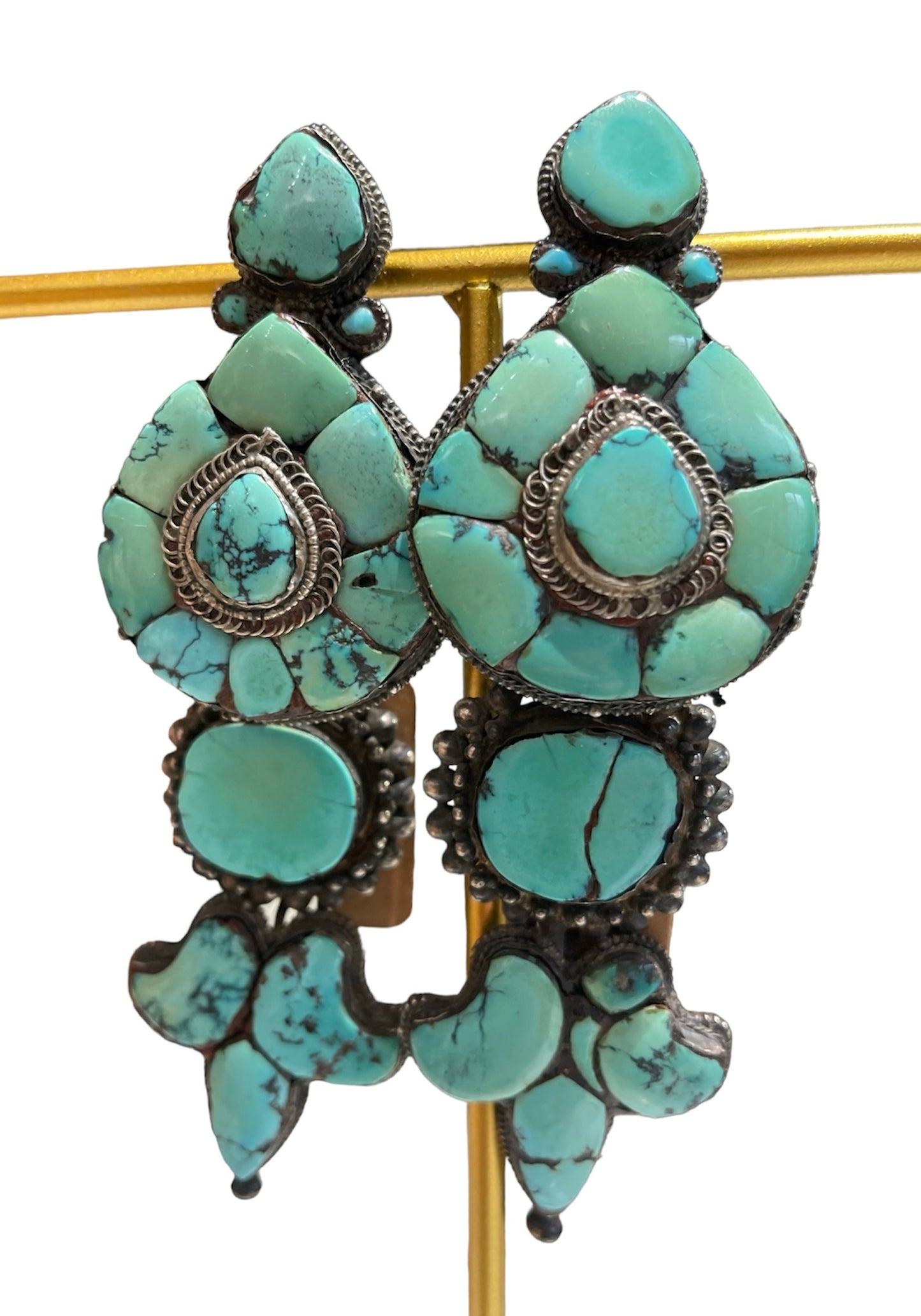 A pair of antique Tibetan turquoise and silver ear pendants