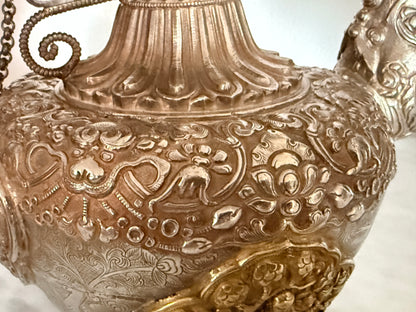 An antique silver and gilt ceremonial Tibetan teapot