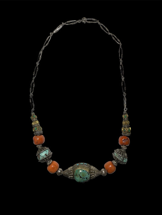 A necklace with antique Tibetan silver beads and coral