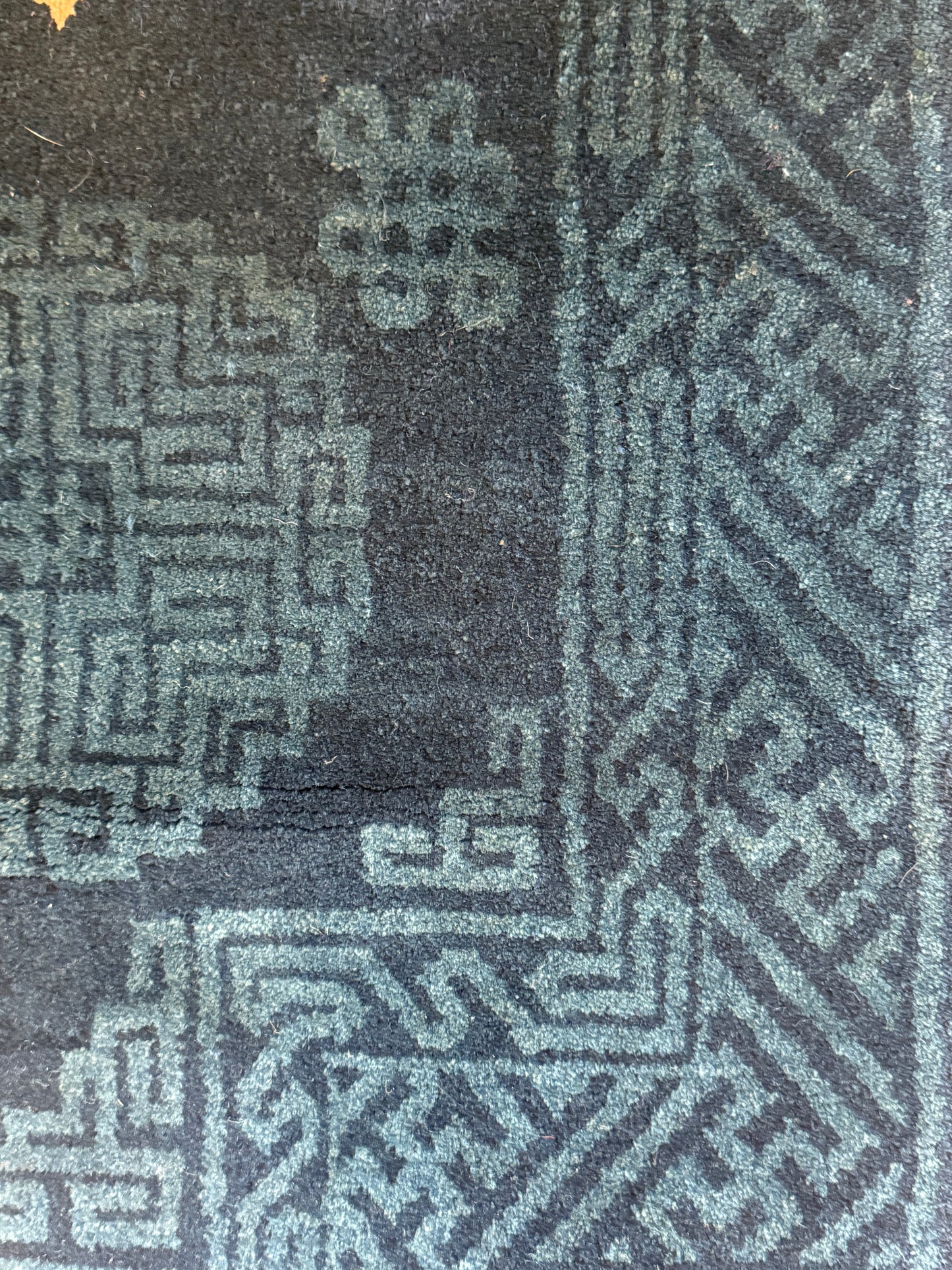 A vintage indigo Tibetan saddle rug