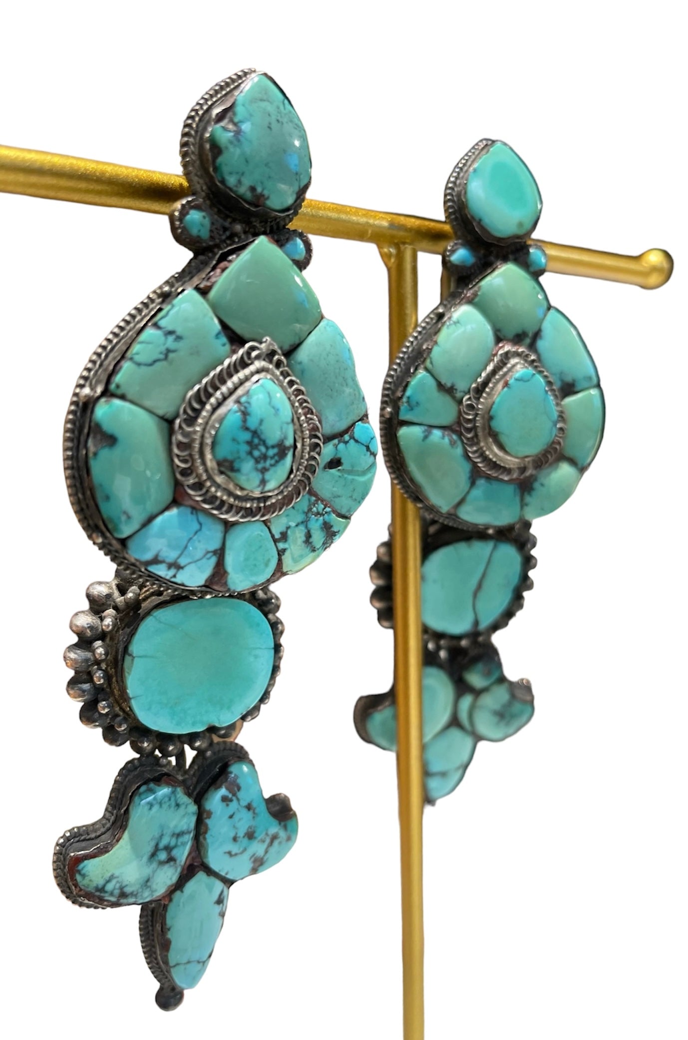 A pair of antique Tibetan turquoise and silver ear pendants