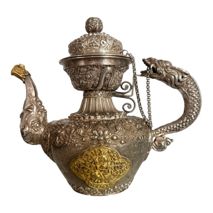 An antique silver and gilt ceremonial Tibetan teapot