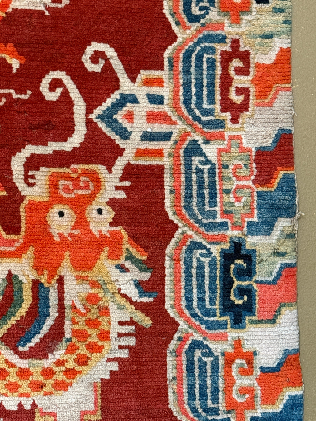An early 20th C., antique Tibetan dragon rug