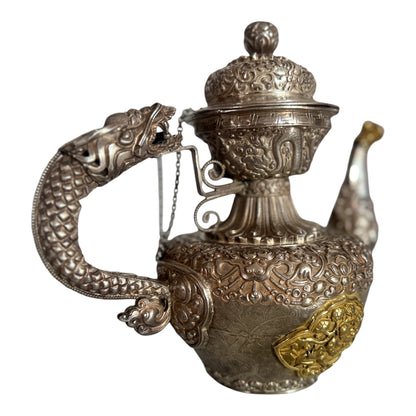 An antique silver and gilt ceremonial Tibetan teapot