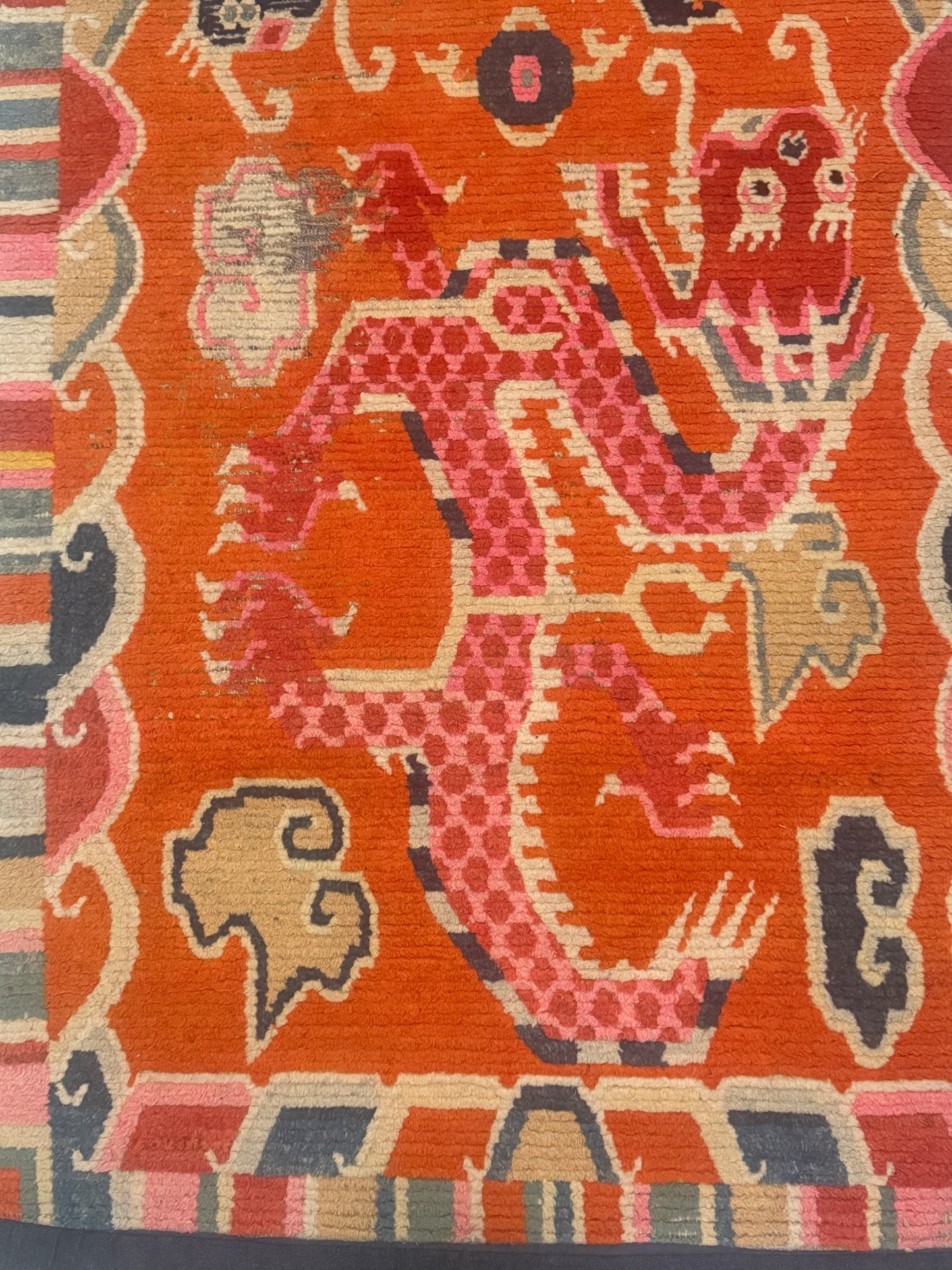 A 19th C., unique antique Tibetan dragon rug