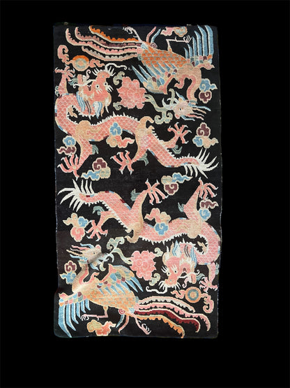 A mid 20th C., Tibetan dragon and phoenix rug