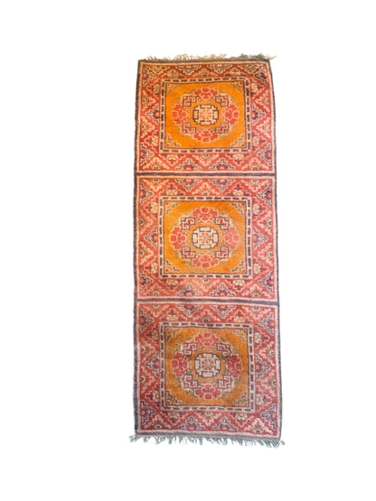 An antique triple seater Tibetan meditation rug