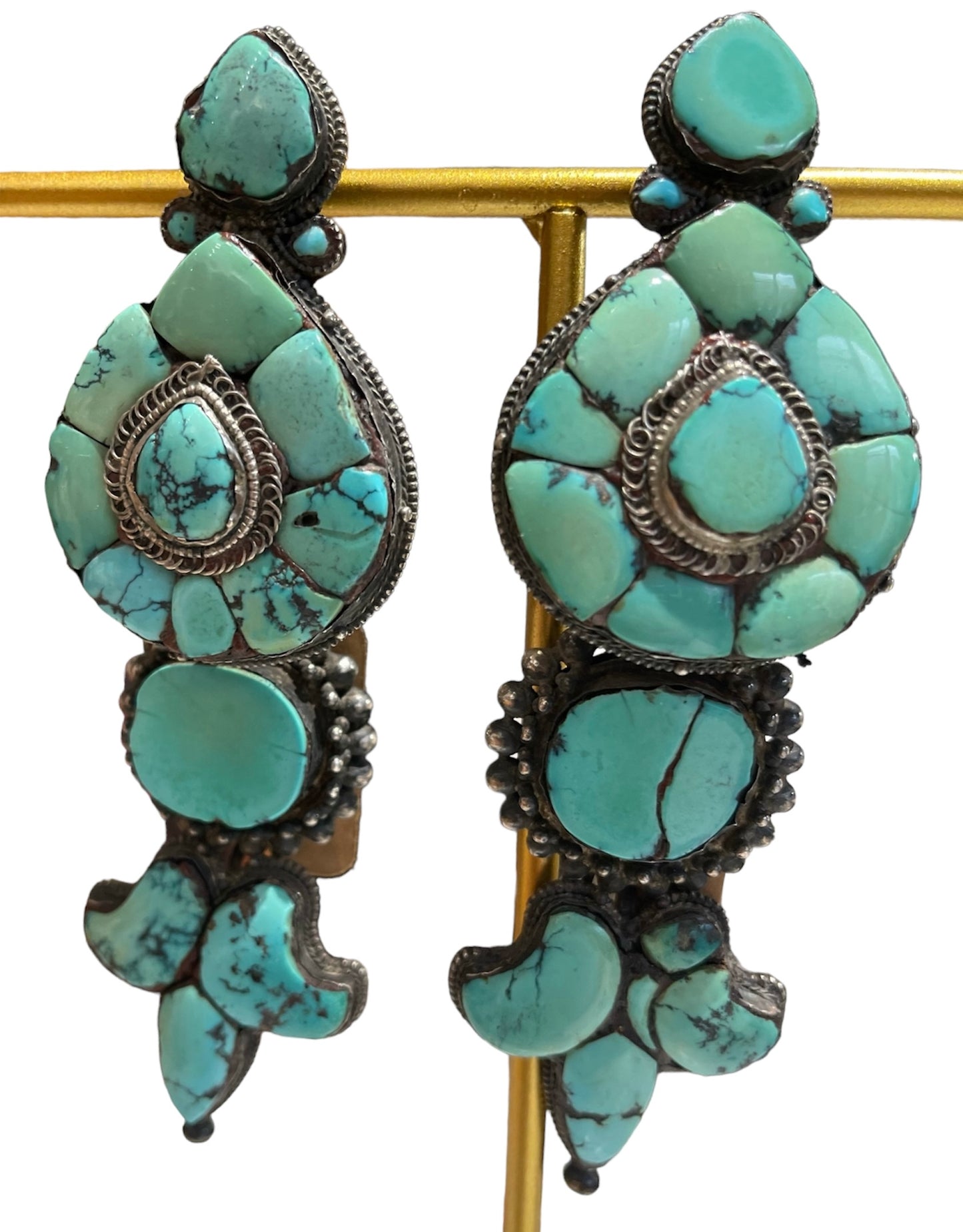 A pair of antique Tibetan turquoise and silver ear pendants