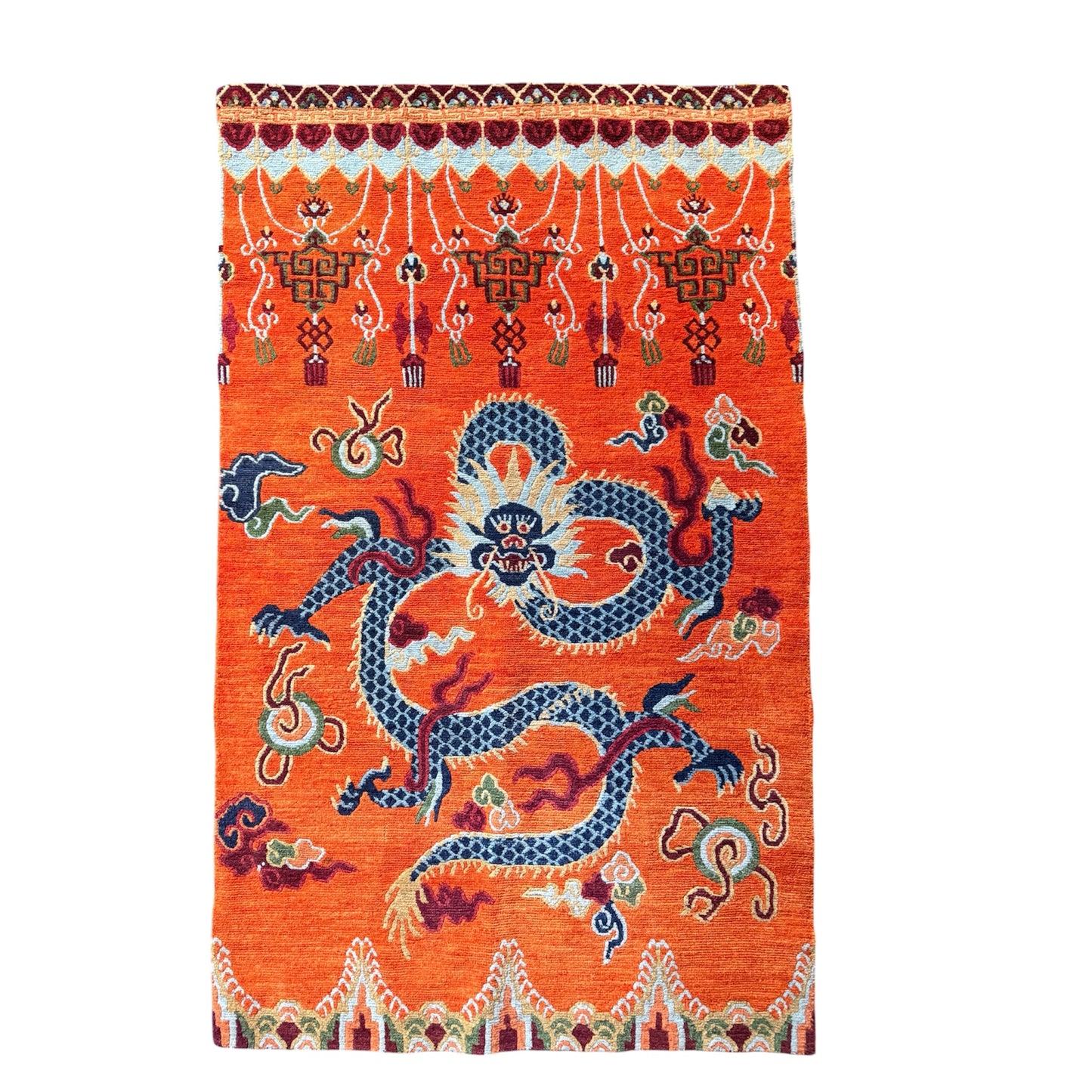 A vintage Tibetan dragon door rug