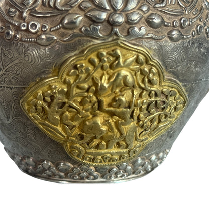 An antique silver and gilt ceremonial Tibetan teapot