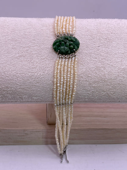 an antique seed pearl and jade plaque bracelet