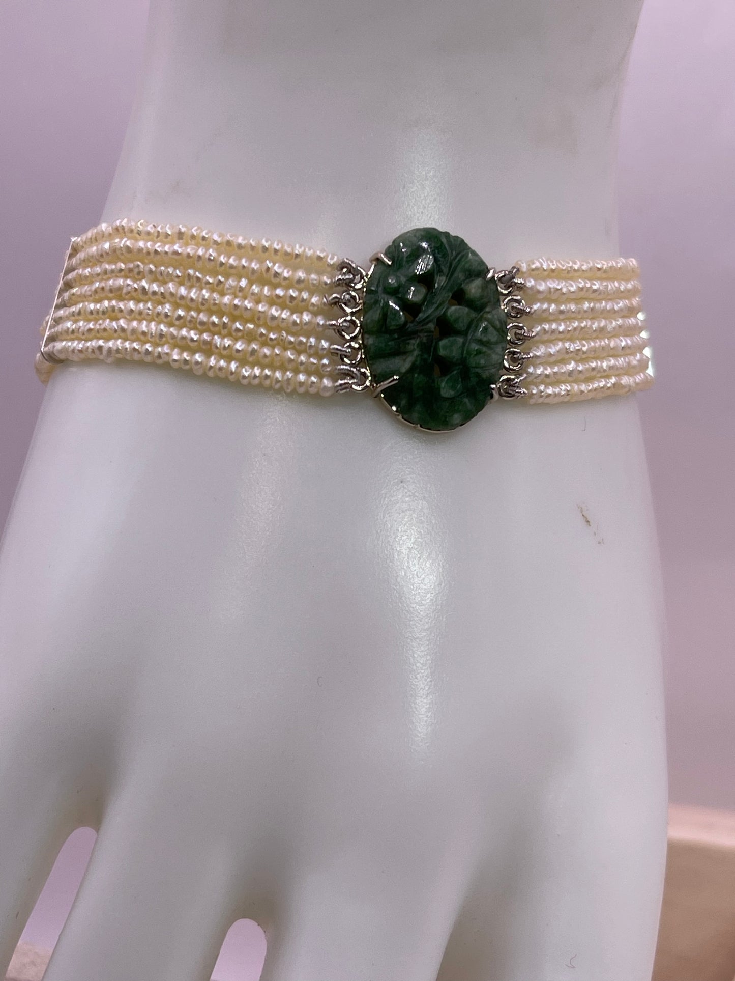 an antique seed pearl and jade plaque bracelet